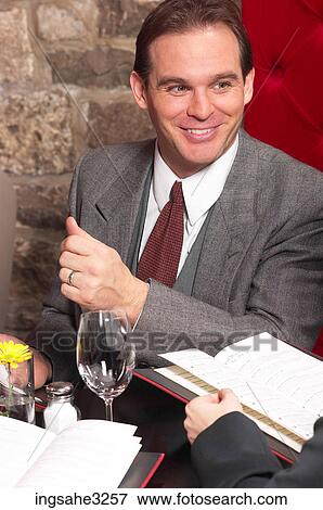 Stock Photo - Two business people at meeting . Fotosearch