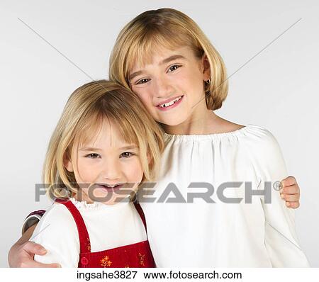 Two Caucasian blonde girls smiling View Large Photo Image Stock Photo - Two Caucasian blonde girls smiling. Fotosearch