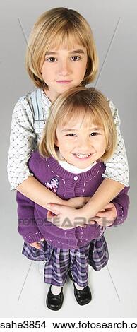 Two Caucasian blonde girls standing View Large Photo Image Picture - Two Caucasian blonde girls standing. Fotosearch
