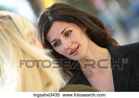 Two mature female adults talking View Large Photo Image Stock Photography - Two mature female adults talking . Fotosearch