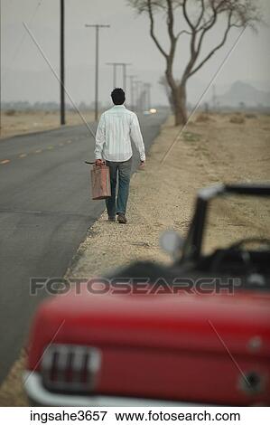Walking down road with gas can View Large Photo Image Stock Photo - Walking down road with gas can . Fotosearch