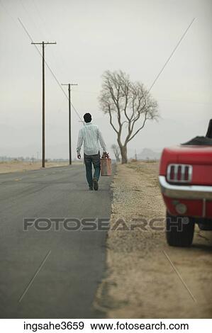 Walking down road with gas can View Large Photo Image Stock Photo - Walking down road with gas can . Fotosearch