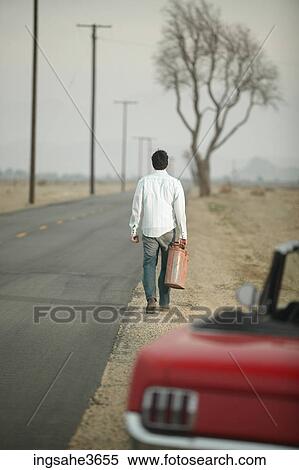 Walking down road with gas can View Large Photo Image Stock Photography - Walking down road with gas can . Fotosearch