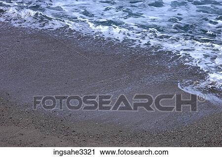 Stock Image - waves on beach . Fotosearch