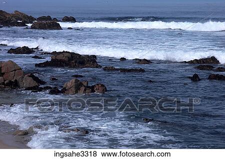 Stock Photo - waves on rocky coast . Fotosearch