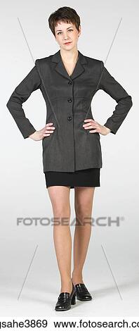 Woman standing with her hands on her waist View Large Photo Image Stock Photo - Woman standing with her hands on her waist. Fotosearch
