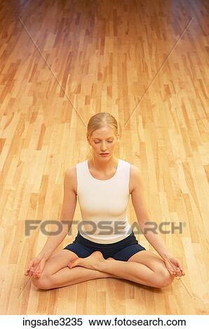 Young adult woman doing yoga View Large Photo Image Stock Photography - Young adult woman doing yoga . Fotosearch