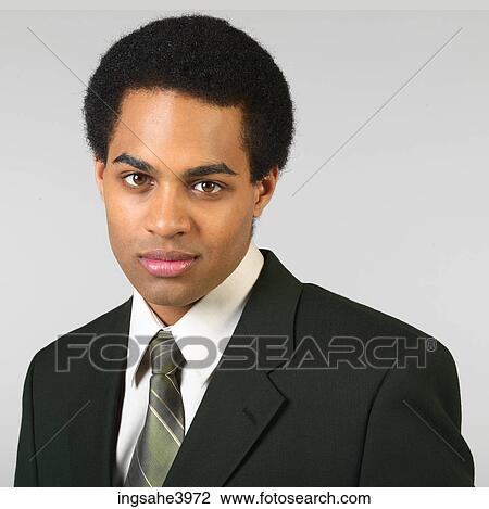Young African American executive gazing ahead View Large Photo Image Stock Image - Young African American executive gazing ahead . Fotosearch