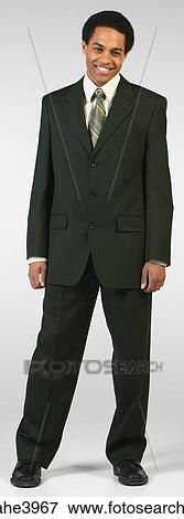 Stock Photo - Young African American executive standing and smiling. Fotosearch