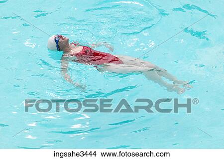 Young female adult swimming View Large Photo Image Picture - Young female adult swimming . Fotosearch