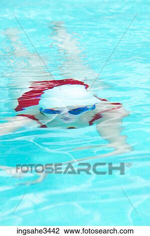 Young female adult swimming View Large Photo Image Stock Image - Young female adult swimming . Fotosearch