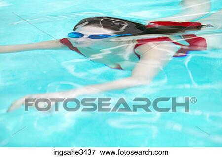 Young female adult swimming View Large Photo Image Stock Photo - Young female adult swimming . Fotosearch