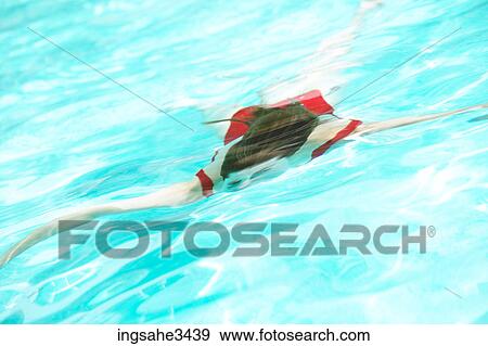 Young female adult swimming View Large Photo Image Stock Photo - Young female adult swimming . Fotosearch