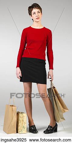 Young woman carrying shopping bags View Large Photo Image Stock Photography - Young woman carrying shopping bags. Fotosearch