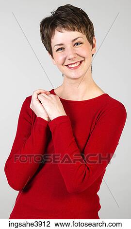 Young woman with short hair and light eyes View Large Photo Image Stock Image - Young woman with short hair and light eyes. Fotosearch