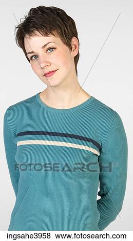 Young woman with short hair and light eyes View Large Photo Image Stock Photo - Young woman with short hair and light eyes. Fotosearch