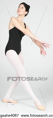 Ballerina standing in a pose View Large Photo Image Stock Photo - Ballerina standing in a pose . Fotosearch