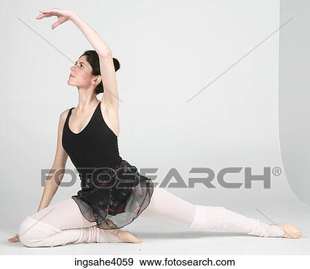 Ballerina stretched on the floor View Large Photo Image Stock Photo - Ballerina stretched on the floor . Fotosearch
