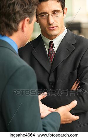 Businessman in conversation View Large Photo Image Picture - Businessman in conversation . Fotosearch