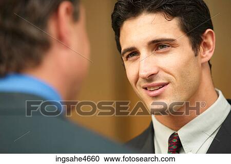 Businessman in conversation View Large Photo Image Stock Image - Businessman in conversation . Fotosearch