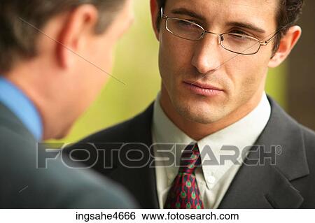 Businessman in conversation View Large Photo Image Stock Photograph - Businessman in conversation . Fotosearch