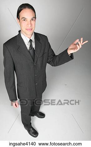 Businessman in gray suit making presentation View Large Photo Image Stock Image - Businessman in gray suit making presentation. Fotosearch