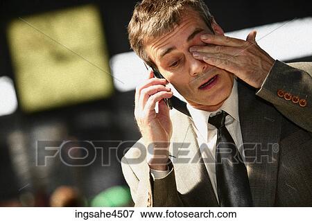 Businessman on cell phone View Large Photo Image Stock Photo - Businessman on cell phone . Fotosearch