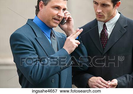 Businessman on cell phone View Large Photo Image Stock Photo - Businessman on cell phone . Fotosearch