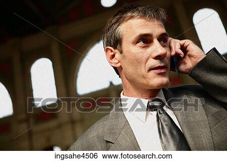Businessman on cell phone View Large Photo Image Stock Photograph - Businessman on cell phone . Fotosearch
