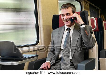Businessman on train  View Large Photo Image Picture - Businessman on train . Fotosearch