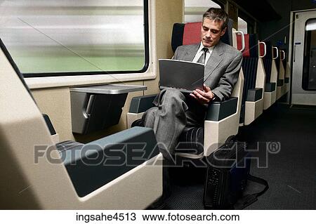 Businessman on train View Large Photo Image Stock Image - Businessman on train . Fotosearch