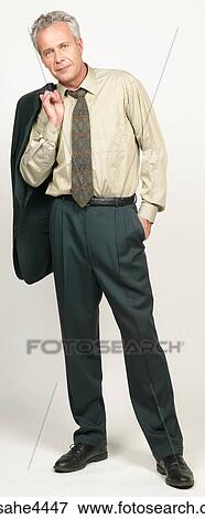 Businessman with suit jacket over his shoulder View Large Photo Image Stock Photo - Businessman with suit jacket over his shoulder. Fotosearch