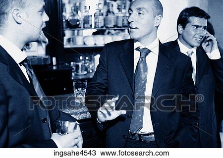 Businessmen in bar View Large Photo Image Stock Image - Businessmen in bar . Fotosearch