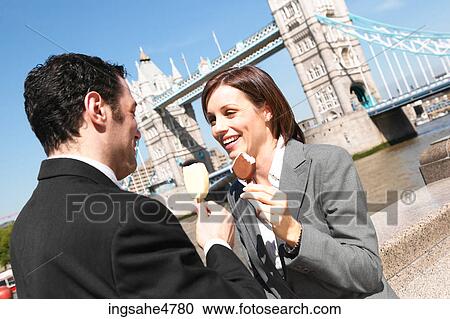 Businesspeople eating ice cream View Large Photo Image Stock Image - Businesspeople eating ice cream . Fotosearch
