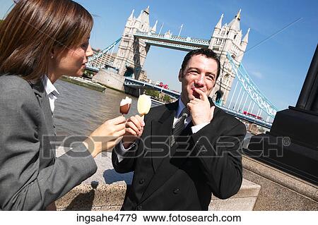 Stock Photo - Businesspeople eating ice cream . Fotosearch