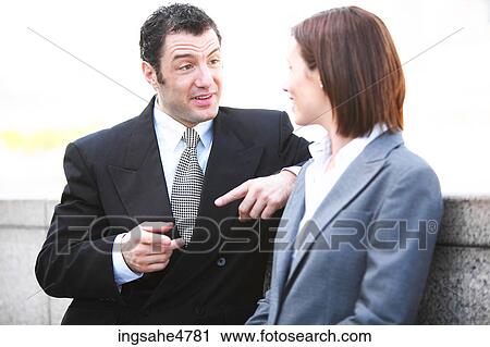 Stock Image - Businesspeople having conversation . Fotosearch