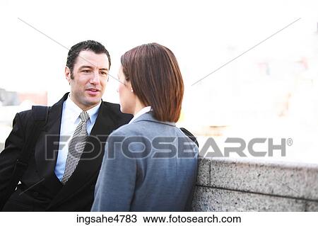 Stock Image - Businesspeople having conversation . Fotosearch