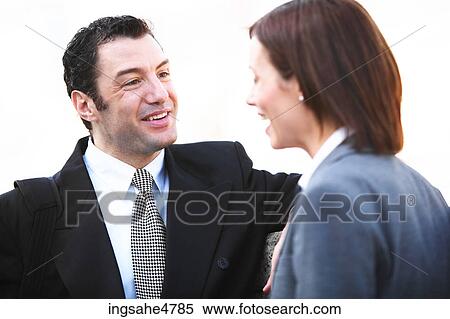 Businesspeople having conversation View Large Photo Image Stock Photography - Businesspeople having conversation . Fotosearch