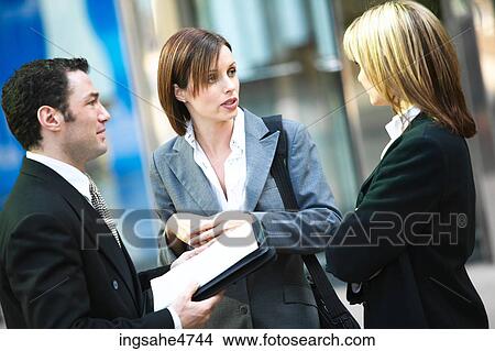 Businesspeople having discussion View Large Photo Image Picture - Businesspeople having discussion . Fotosearch