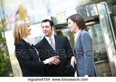 Businesspeople having discussion View Large Photo Image Picture - Businesspeople having discussion . Fotosearch