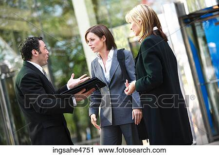 Businesspeople having discussion View Large Photo Image Stock Image - Businesspeople having discussion . Fotosearch