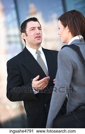 Stock Image - Businesspeople having discussion . Fotosearch