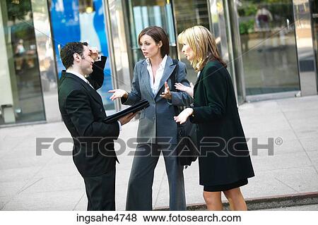 Stock Photo - Businesspeople having discussion . Fotosearch