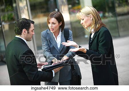 Stock Photo - Businesspeople having discussion . Fotosearch