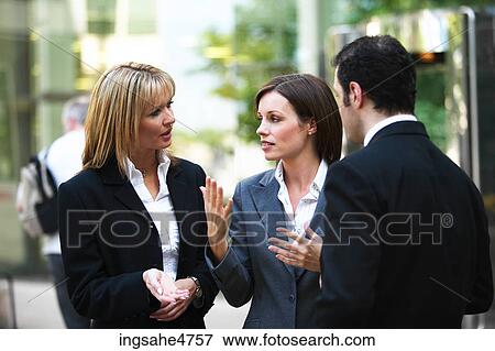Businesspeople having discussion View Large Photo Image Stock Photo - Businesspeople having discussion . Fotosearch