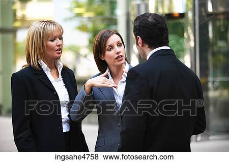 Businesspeople having discussion View Large Photo Image Stock Photo - Businesspeople having discussion . Fotosearch
