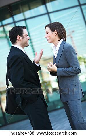 Businesspeople having discussion View Large Photo Image Stock Photo - Businesspeople having discussion . Fotosearch