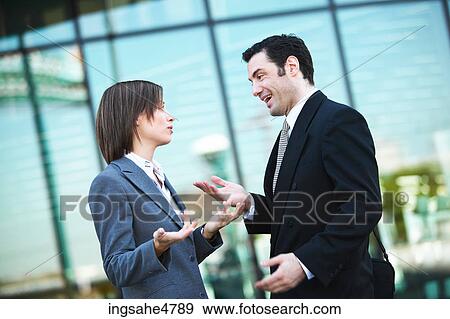 Businesspeople having discussion View Large Photo Image Stock Photo - Businesspeople having discussion . Fotosearch