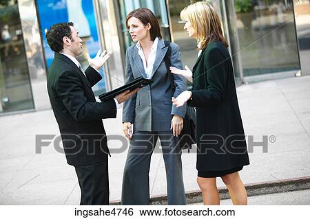 Businesspeople having discussion View Large Photo Image Stock Photograph - Businesspeople having discussion . Fotosearch