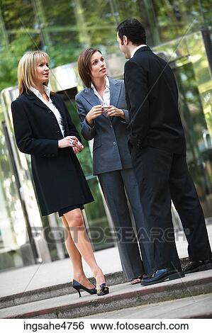 Businesspeople having discussion View Large Photo Image Stock Photograph - Businesspeople having discussion . Fotosearch
